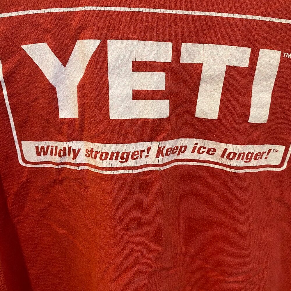 red oversized yeti graphic t-shirt off the shoulder cut